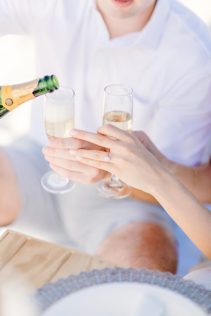 A man pouring wine in two glasses