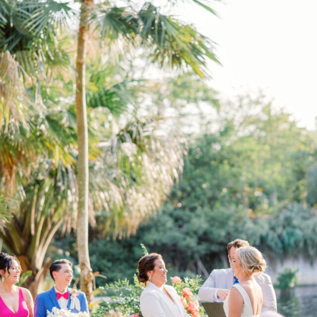 Two girls smiling together at a wedding